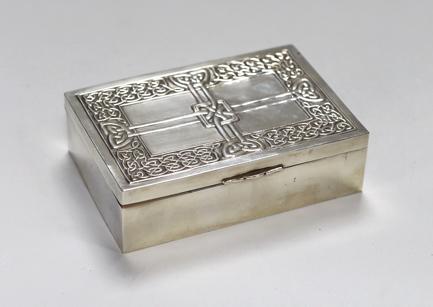 A Scottish white metal Iona rectangular box and cover, with Celtic knot decoration, 13.2cm, 8.7oz, stamped 'Iona AR', for Alexander Ritchie?